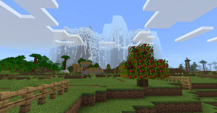 Orchard, houses and mountain